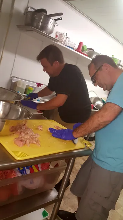 Hand-Trimming Fresh Chicken to Order